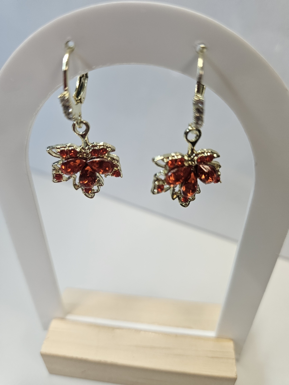 Gold-Tone Floral Drop Earrings with Red Crystal Accents
